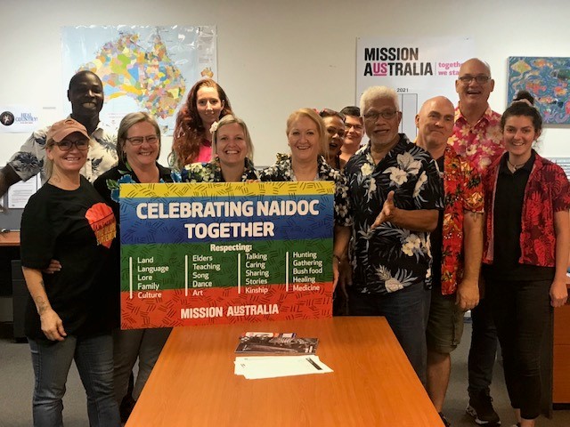 People smiling and celebrating NAIDOC week together.  